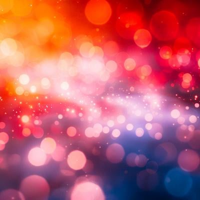暖色と寒色が溶け合う玉ボケのグラデーションの写真