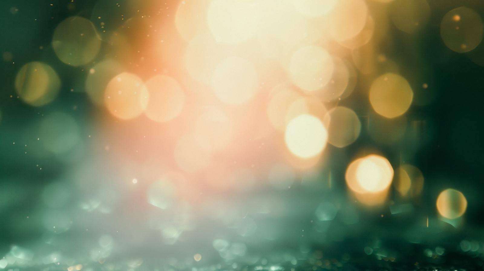 Abstract background with warm-colored light and green mingling, round bokeh balls (Tamaboke) floating across the entire screen