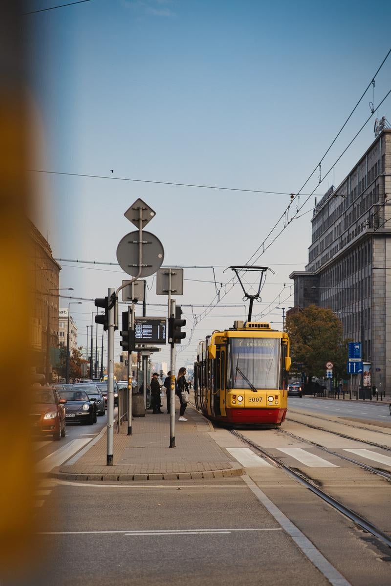 Urban Street Photography with Yellow Trams in Krakow - free stock photo