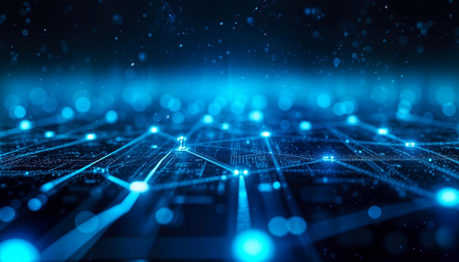 Image of network with blue glowing nodes and connection lines spreading in darkness