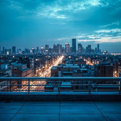 マンション屋上から見下ろす夜間の街並みと高層ビルの写真