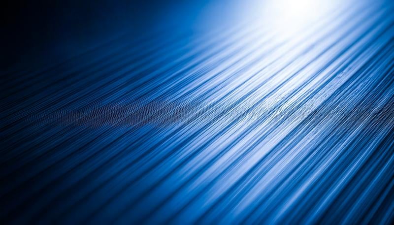 光が走る青いスチールのテクスチャー