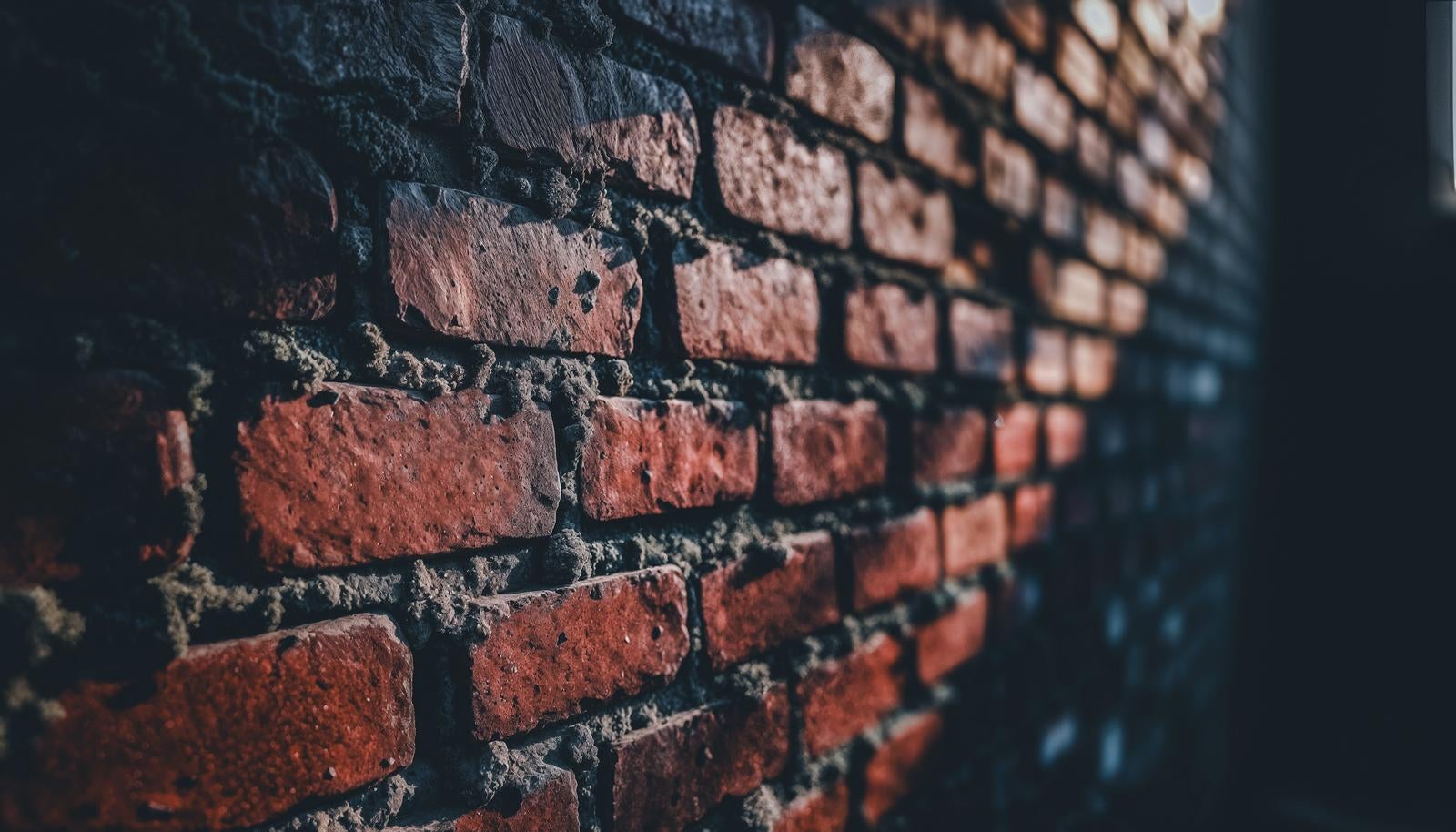 赤レンガの壁を斜めのアングルからクローズアップで捉え、奥がぼけているAI画像