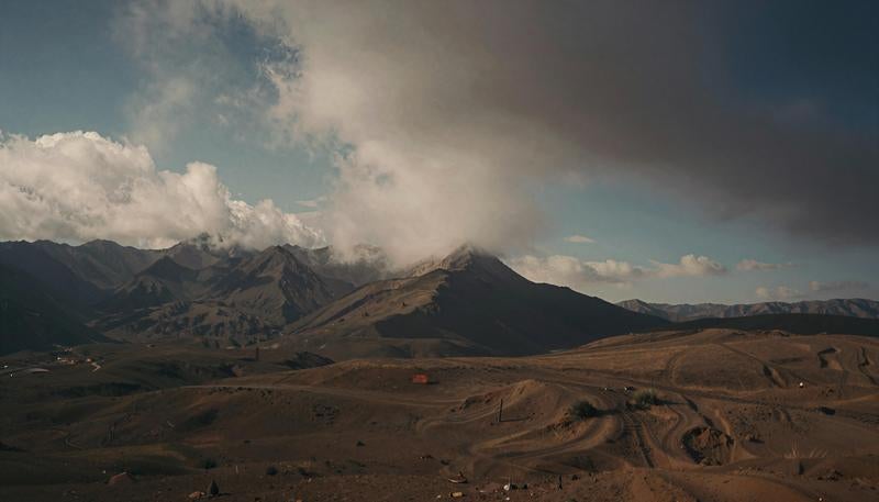 Mining Operations in Volcanic Region with Cloud-Covered Mountains