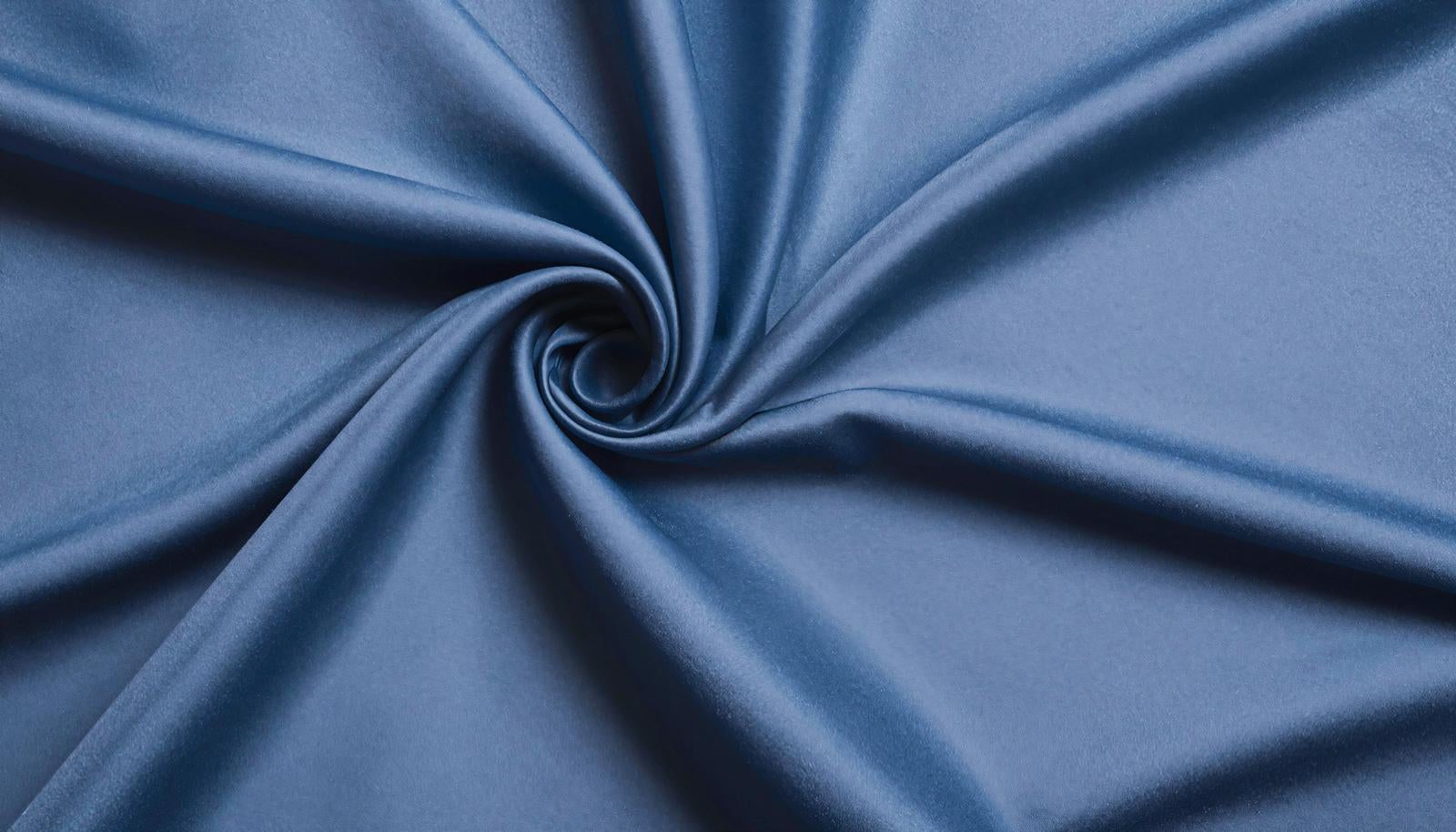 Blue satin fabric twisted in a spiral at the center with radially spreading drapes creating a textured appearance