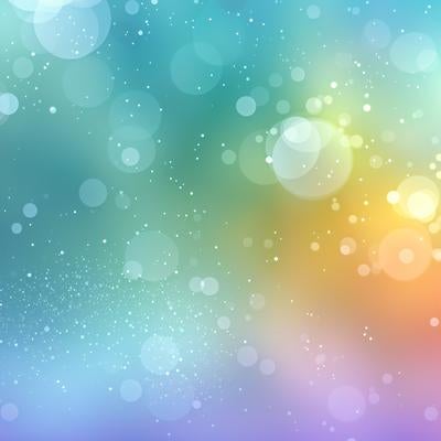 虹色グラデーションと光粒が舞うパステル背景の写真