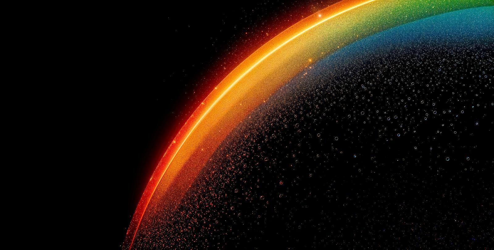 「暗闇に輝く七色の光の帯」の写真