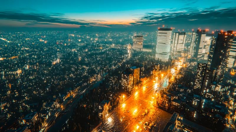 煌めく街並みと高層ビルが彩る夜空の写真