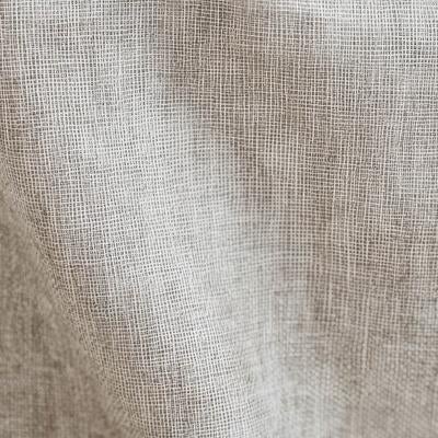 ベージュ色のリネン風布地の細かな織り目をクローズアップの写真