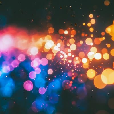 カラフルな光の玉が舞う幻想的な背景素材｜玉ボケとグラデーションの写真