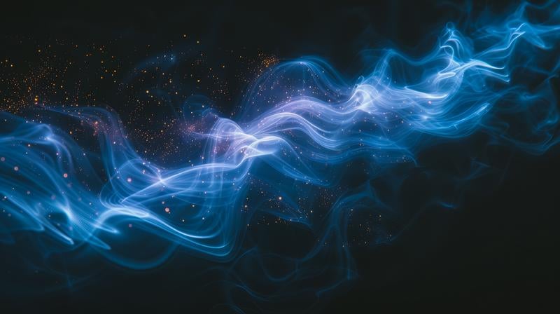 波打つ青い光の粒子の写真