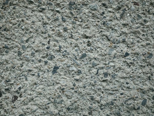 砂利の詰まったコンクリート（テクスチャー）の写真