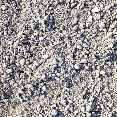 細かい砂利道の地面（テクスチャー）の写真