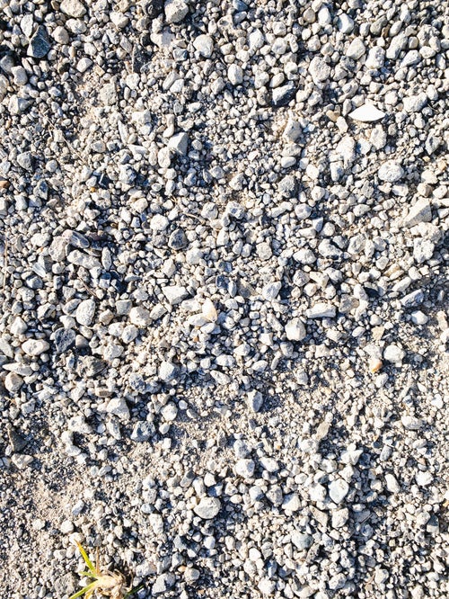 細かい砂利道の地面（テクスチャー）の写真