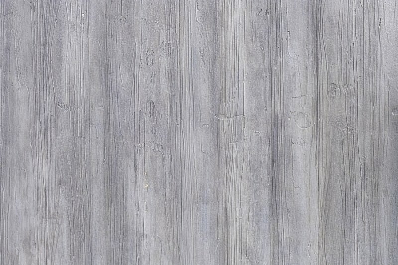 灰色に塗られた木目調の壁（テクスチャ）の写真