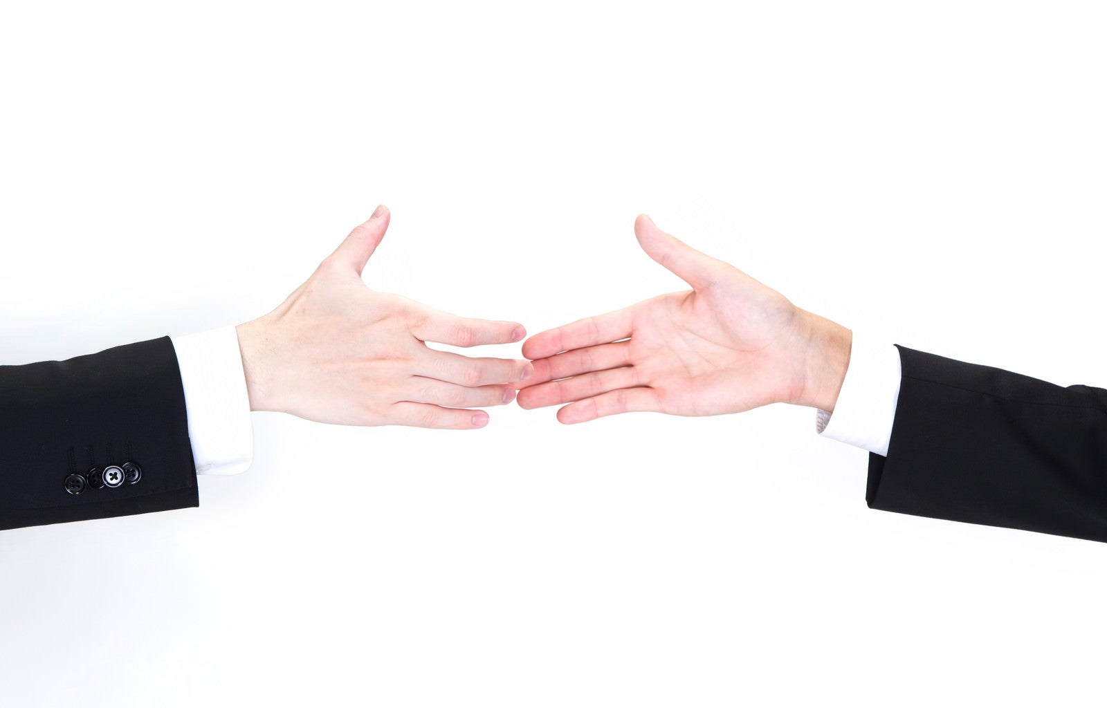 「握手を交わすビジネスマンの手」の写真