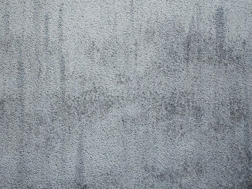 シミの付いたコンクリート壁（テクスチャー）の写真