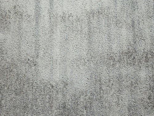 斑に付いたシミのコンクリート壁（テクスチャー）の写真