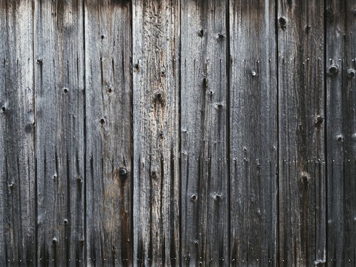古い木目の板（壁）の写真