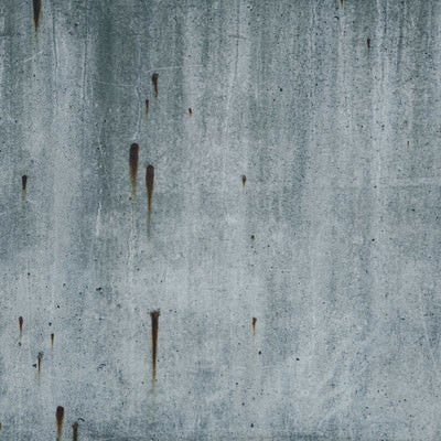 錆び模様が目立つコンクリート（テクスチャー）の写真