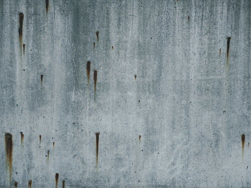 錆び模様が目立つコンクリート（テクスチャー）の写真