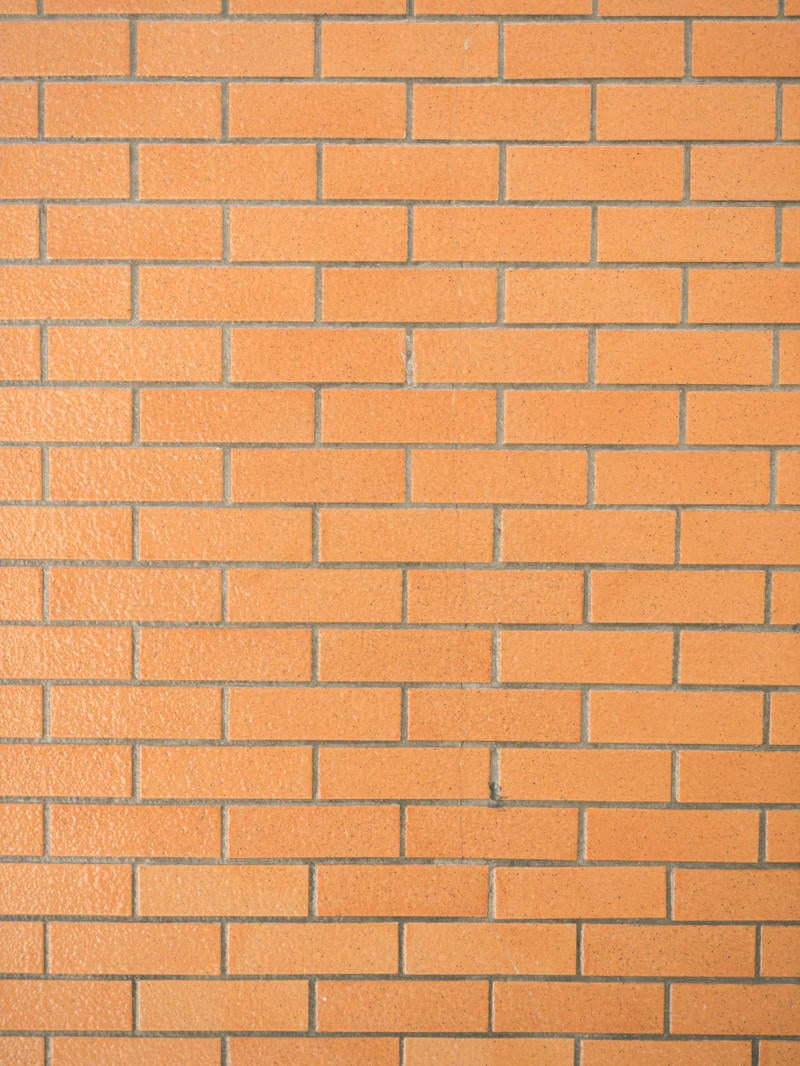 一色のレンガ調タイル壁（テクスチャ）の写真