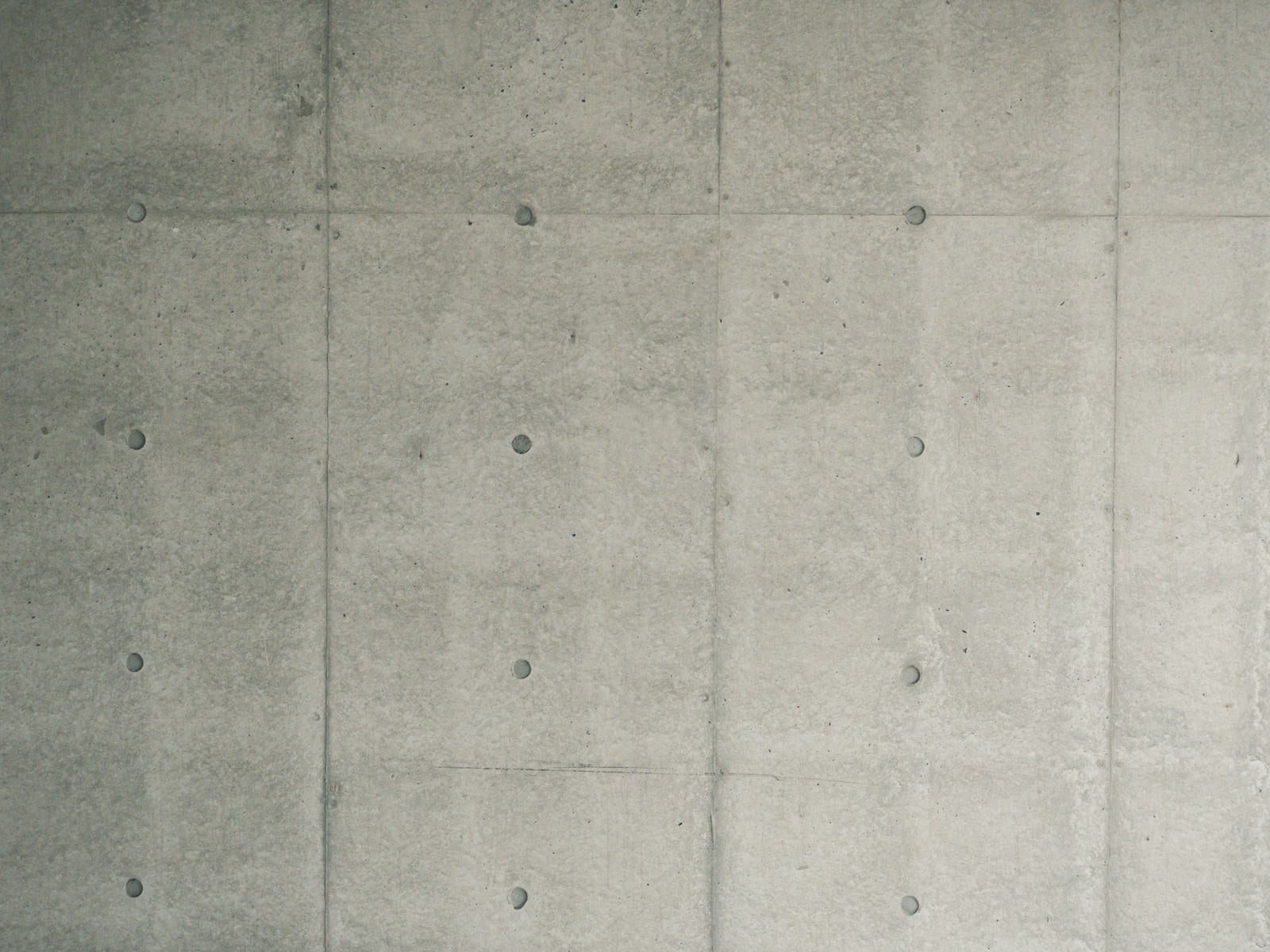 「コンクリート壁の明暗差（テクスチャ）」の写真