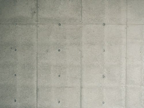 コンクリート壁の明暗差（テクスチャ）の写真