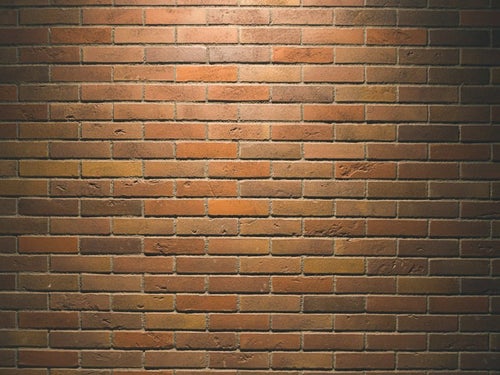 照明の当たるレンガ壁（テクスチャー）の写真
