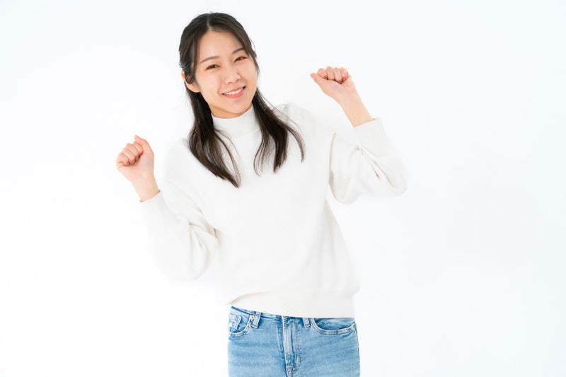 心躍る女性の写真