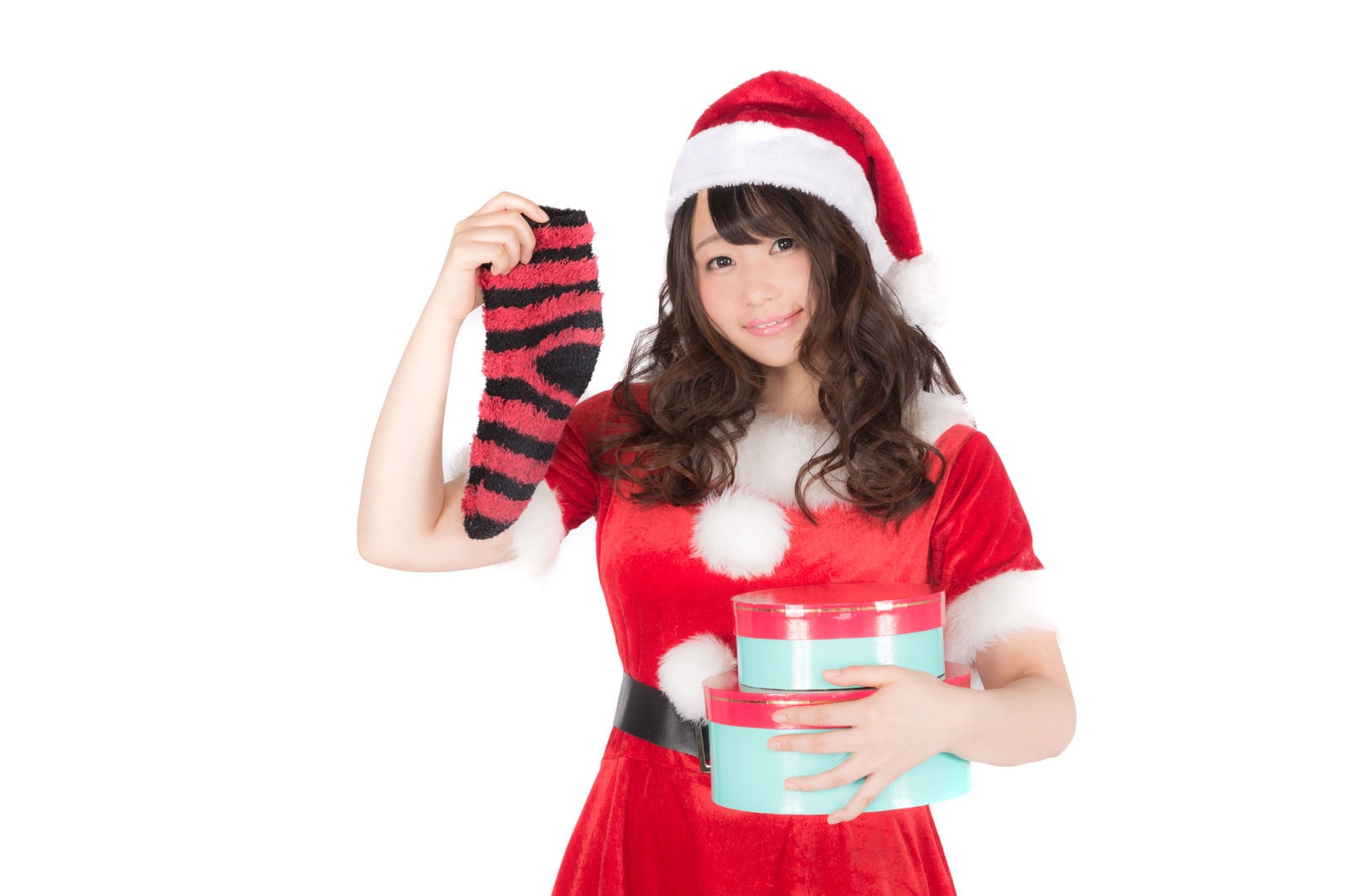 「靴下とプレゼントを持った女性サンタさん」の写真［モデル：茜さや］