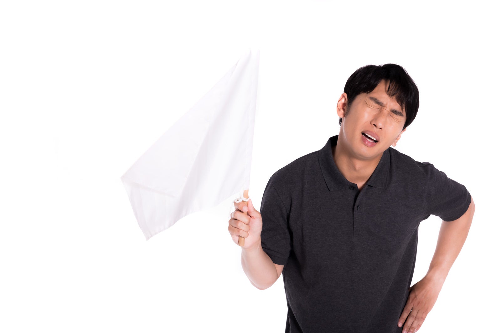 「白旗を上げる男性」の写真［モデル：大川竜弥］