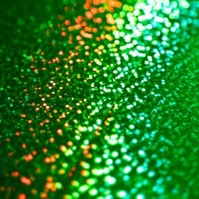 緑色のキラキラ光る粒子の写真