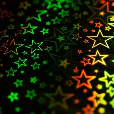 緑とオレンジの星型ホログラフィック背景の写真