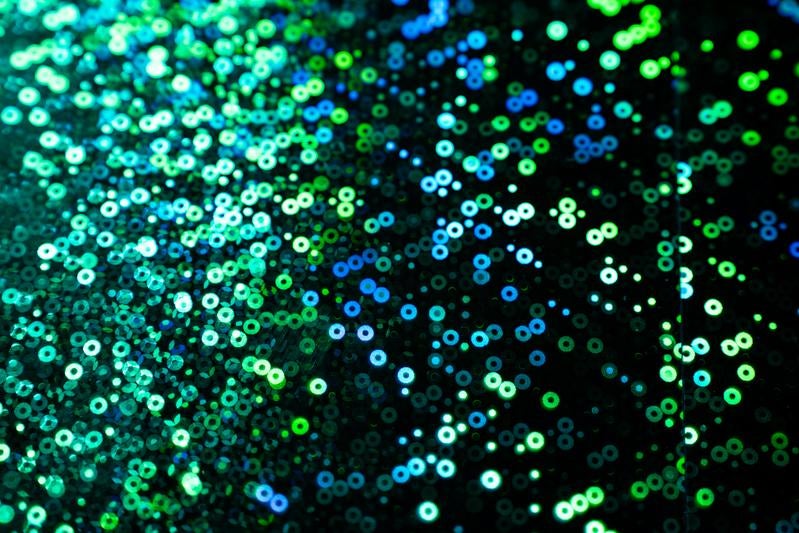 キラキラ光る円形粒子背景の写真