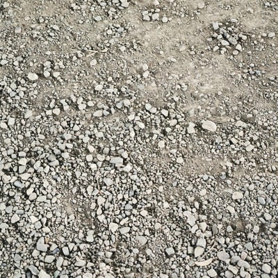 カラカラに乾いた地面の土（テクスチャ）の写真