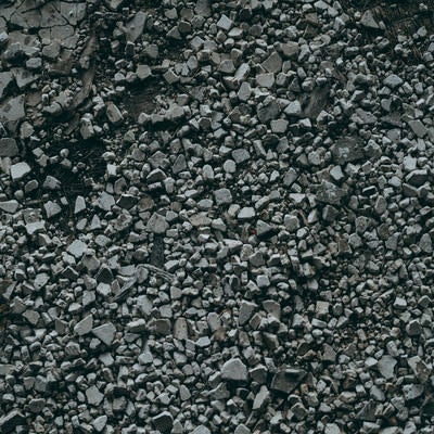 視界に広がる灰色の小石（テクスチャ）の写真