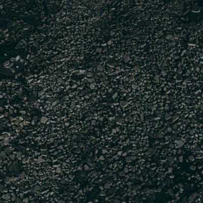 暗めな細かいアスファルトの写真