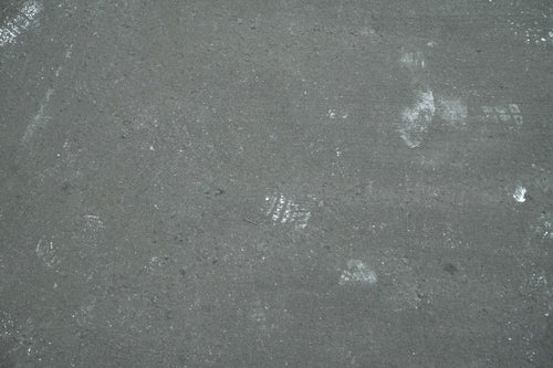 コンクリートに残る足跡（テクスチャー）の写真