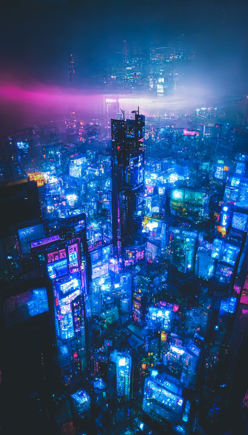 「青い光に包まれる仮想空間の高層ビル群」の写真