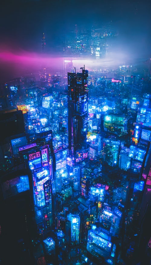 青い光に包まれる仮想空間の高層ビル群の写真