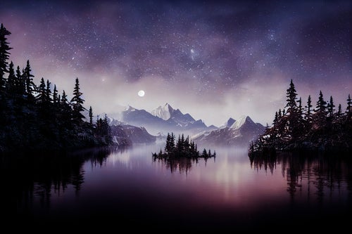 星空きらめく湖と山々のシルエットの写真