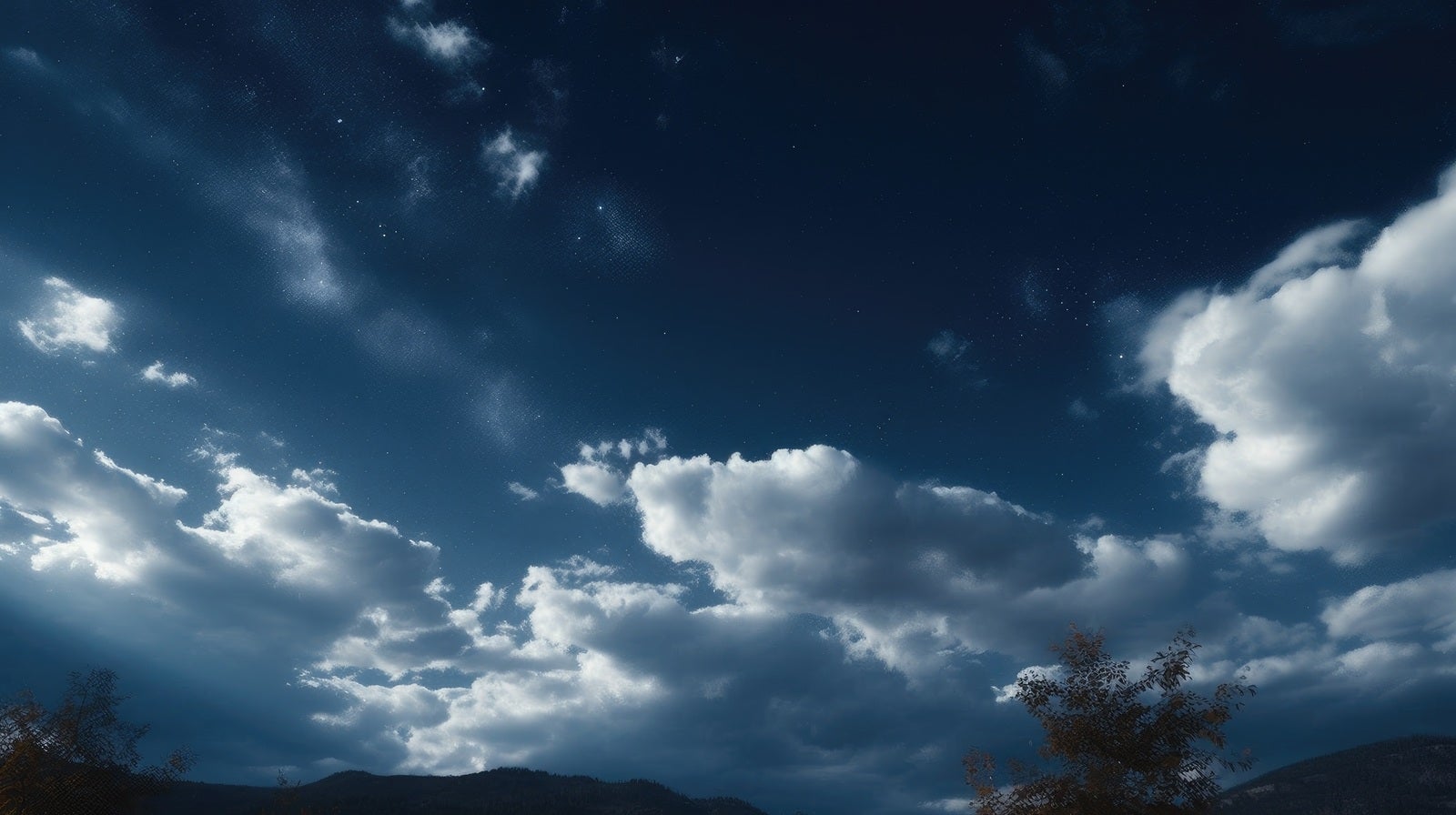 「雲の合間から見える星空」の写真