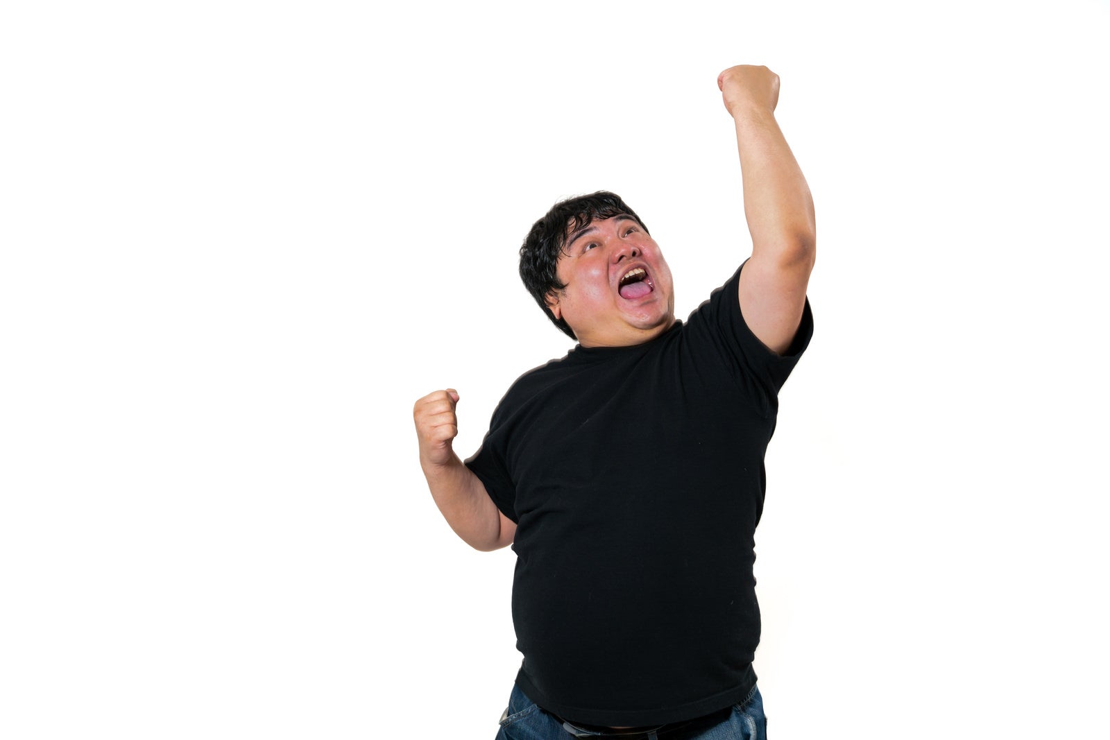 「全力で拳を突き上げる」の写真［モデル：段田隼人］