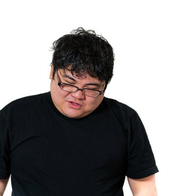 疲労困憊のメガネ着用の男性の写真