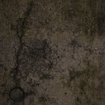 暗がりのコンクリート壁のテクスチャーの写真