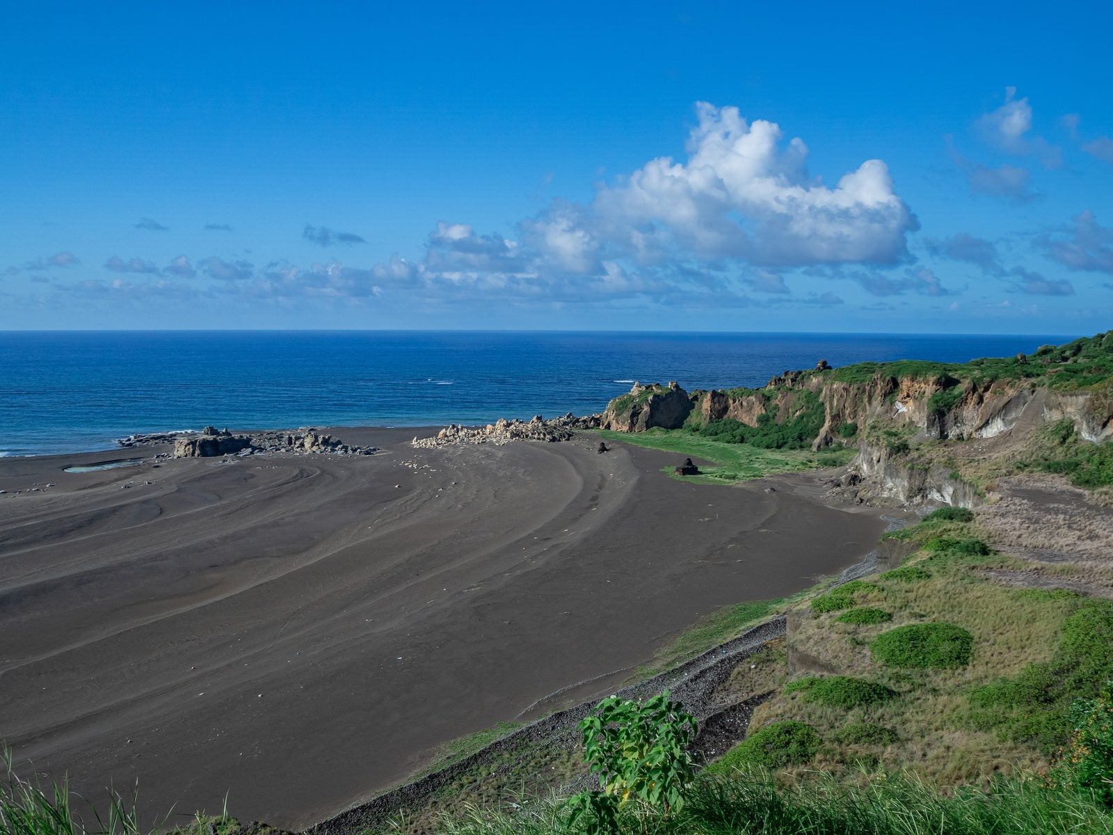 Traces of coastlines like tree rings on sandy beaches formed by repeated uplift - free stock photo