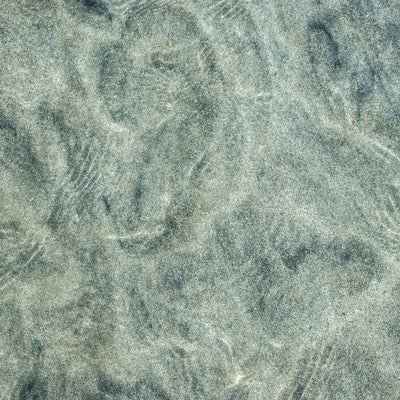 海水と砂紋の模様の写真