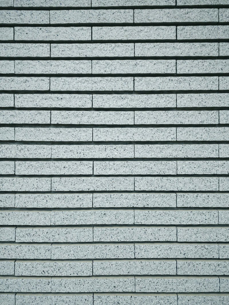 「長方形の石タイル壁（テクスチャー）」の写真