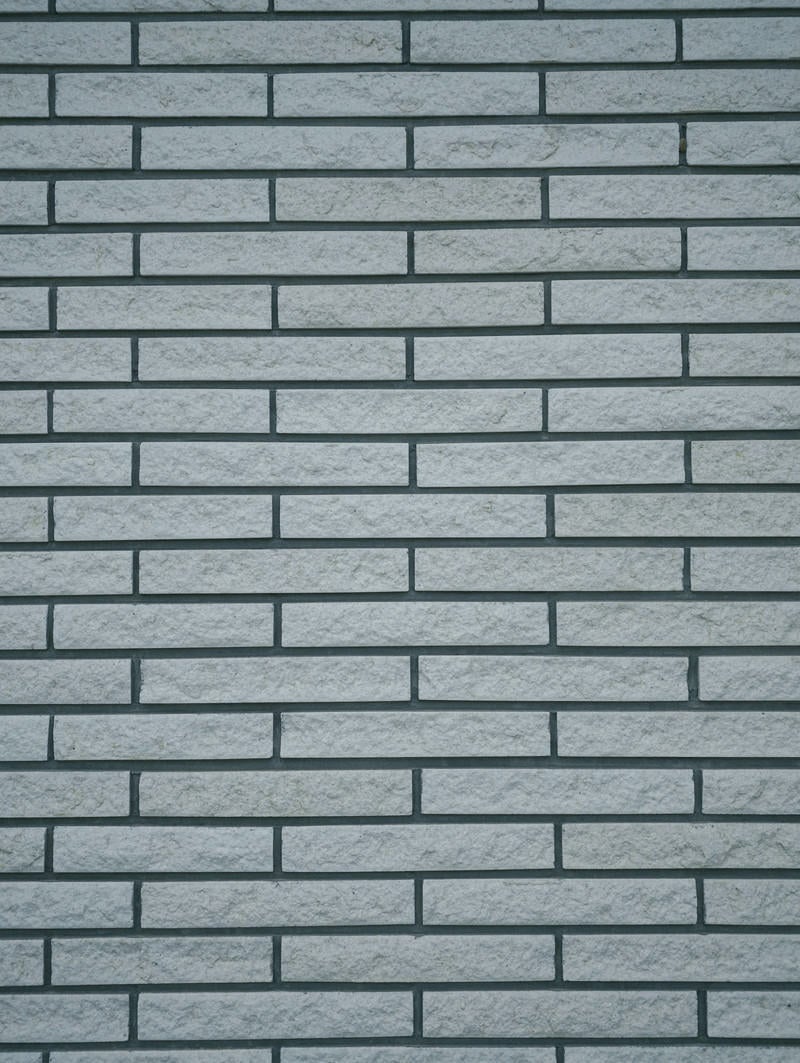 「細長い長方形の石タイル壁（テクスチャー）」の写真